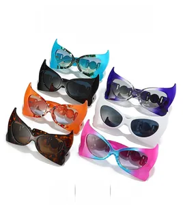 Showcase of seven bat-wing cat eye sunglasses in various colors on white background