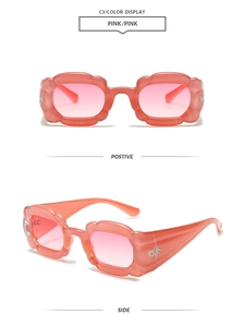 Detailed front and side view of pink flower-shaped Y2K sunglasses with gradient lenses