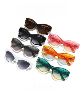 Detailed stack of colorful cat eye sunglasses showing multiple frames and gradient lenses