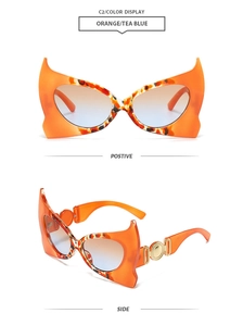 Front and side views of orange bat-wing sunglasses with gradient tea blue lenses