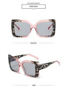 Detailed front and side views of square tortoiseshell sunglasses with pink inner frames
