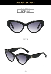 Macro detail of retro cat eye sunglasses with golden LH metal logo on black temples