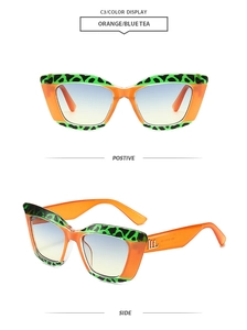 Détail de lunettes de soleil œil de chat orange avec accents léopard et verres dégradés