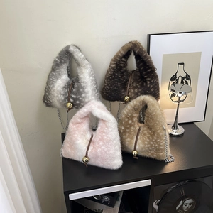 Chic plush faux fur bucket bags with deer spot patterns and elegant gold ball clasps