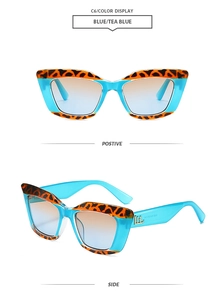 Détails de lunettes œil-de-chat bleues avec motif léopard et verres dégradés orange