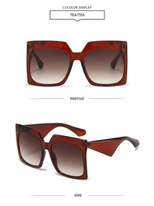Detail of square oversized sunglasses featuring brown gradient lenses and wide temples
