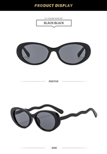 Detail view showing oval black sunglasses with unique wavy temples and front side angle