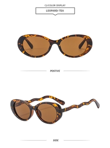 Detail view of oval leopard print sunglasses with wavy temples and tea lenses