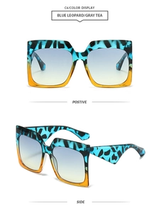 Macro detail of square sunglasses featuring blue leopard frames and gradient tea lenses