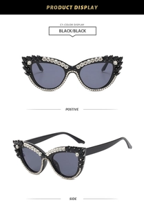 Detailansicht der schwarzen Cat-Eye Sonnenbrille mit Strass- und Edelsteinverzierung