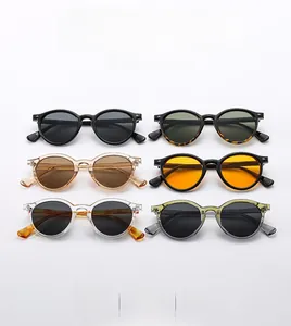 Six pairs of retro round sunglasses in various frame colors and tinted lenses displayed