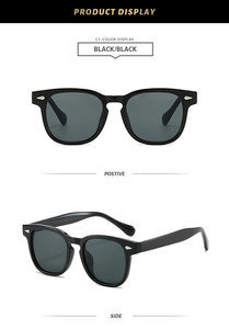 Close-up of square black sunglasses featuring silver arrow rivets and dark lenses