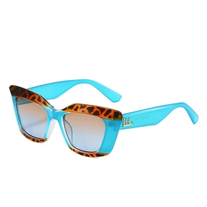 Lunettes de soleil œil-de-chat avec détails en écaille et verres dégradés bleu-orange