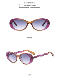 Detail of vintage oval tea purple sunglasses with unique wavy temple design and gradient lens