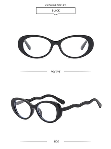 Detail of trendy black oval sunglasses featuring unique wavy temples for a modern look
