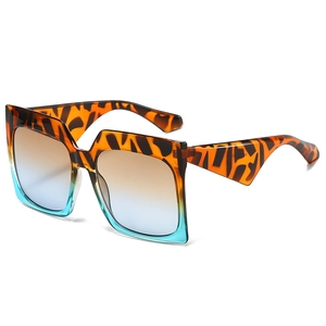 Tortoiseshell square oversized sunglasses with blue gradient lenses and wavy temples