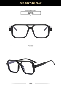 Detail view of black oversized geometric eyeglass frames with silver rivet accents