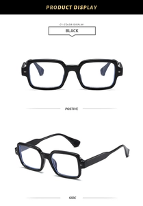 Detail view showing black square frame glasses with anti-blue light lenses and metal rivets