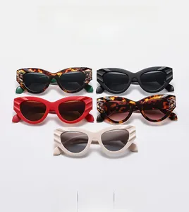 Detail showing cat eye sunglasses in various colors with unique wavy temple texture