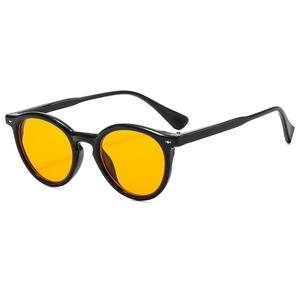 Retro round black sunglasses with orange lenses and silver rivets shown from a 45-degree angle