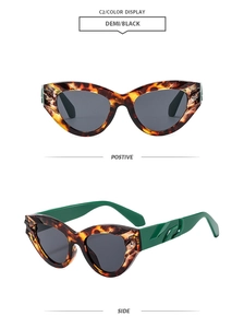 Detail of retro cat-eye sunglasses with demi tortoise frames and vibrant green temples