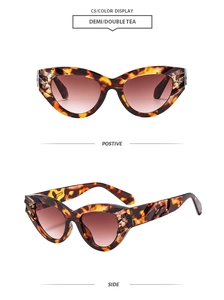 Detail view of tortoiseshell cat eye sunglasses with textured arms and tea gradient lenses