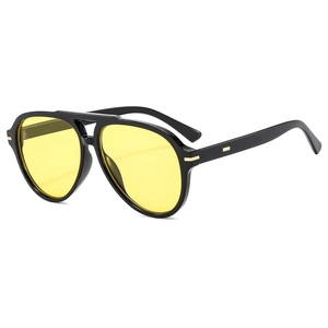 Classic black aviator sunglasses with yellow lenses and elegant gold metal temple detail