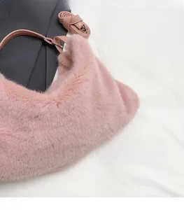 Close-up of soft pink faux fur material on plush shoulder bag with smooth texture