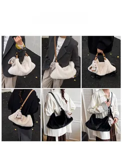 Detail view of large faux fur shoulder bag with plush rabbit pendant and leather strap
