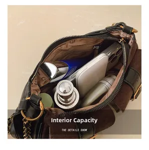 Close-up of internal storage space showing phone and cosmetics in the baguette bag