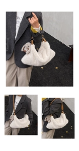 Detail shot of white fuzzy faux fur bag with brown leather handles and rabbit charm