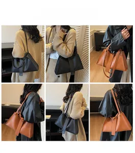 Close-up of stylish black and brown leather underarm bags showing texture and strap details