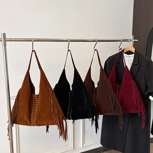Fringed faux suede tote bags in four colors with rivet details and spacious design