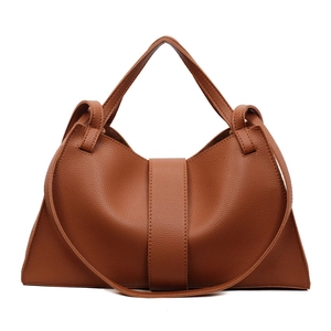 Brown lychee pattern leather shoulder bag with crescent shape and adjustable strap