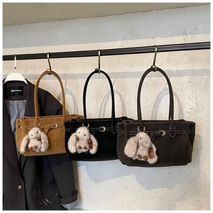 Suede tote bags in brown, black, and dark coffee colors with plush rabbit pendants