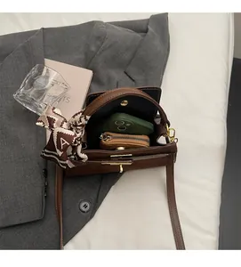 Brown matte suede handbag interior view showing large capacity for phone and wallet