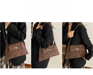 Lifestyle view of retro leopard print crossbody bag with gold chain and turn-lock