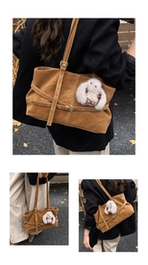 Detail of vintage brown tote bag with suede texture and cute white plush rabbit charm