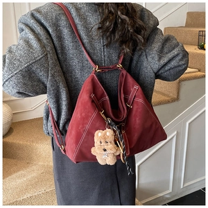 Vintage suede multi-functional backpack tote bag with cute bear charm for women daily use.