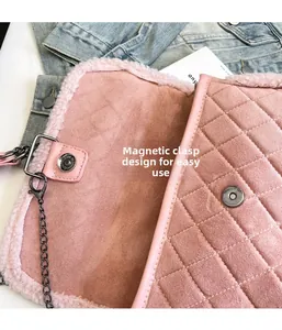 Detail of light pink quilted bag featuring magnetic closure and soft plush trim