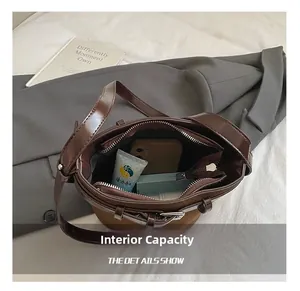 Top view of brown bucket bag interior showing large capacity for phone and essentials