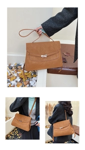 Detail view showing caramel brown vintage briefcase bag with metallic clasp and strap