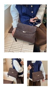 Detail view of retro brown briefcase showing metallic twist lock and adjustable strap
