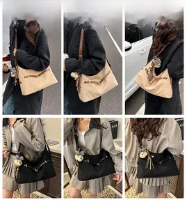 Hobo shoulder bags in khaki and black with plush bear charms shown on a model