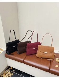 Detail view of large capacity vintage briefcases in black, coffee, burgundy and tan colors