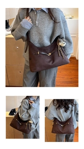 Detailed view of dark brown suede hobo bag with metal buckle and cute bear charm pendant