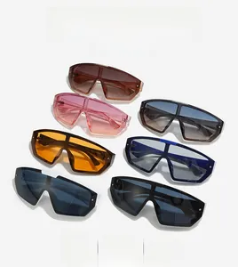 Flat lay of colorful oversized shield sunglasses showing various lens tints and frames