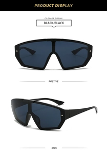 Close-up of black oversized cycling sunglasses showing positive and side views in detail