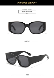 Vue détaillée de lunettes de soleil rétro noires élégantes avec de larges branches pour conduire