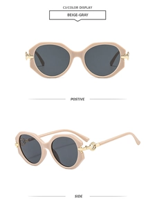 Detail view of beige-gray round frame sunglasses with golden metal hinges and dark lenses